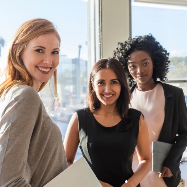 Three women smiling