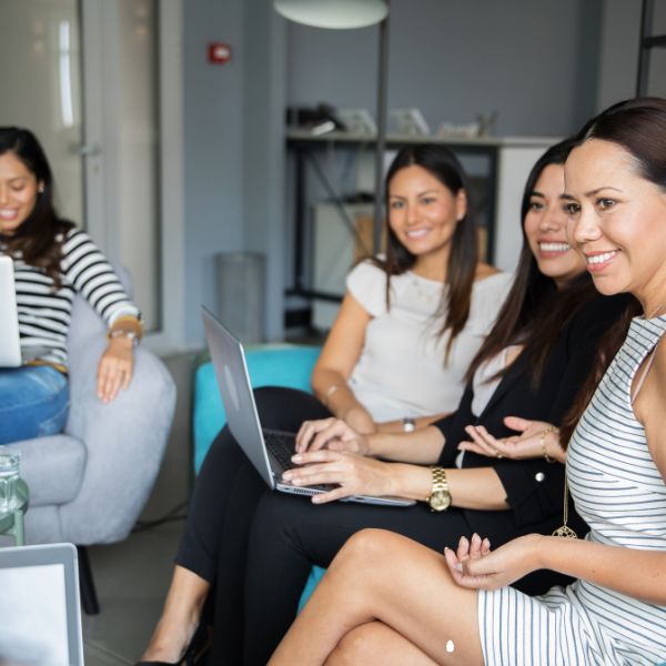 Women sitting and discussing company culture