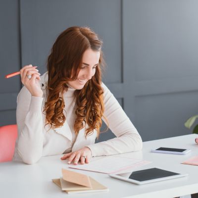 Woman entrepreneur working on a small business marketing plan