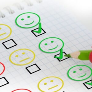 employee satisfaction survey showing happy face, neutral face and portion of red face