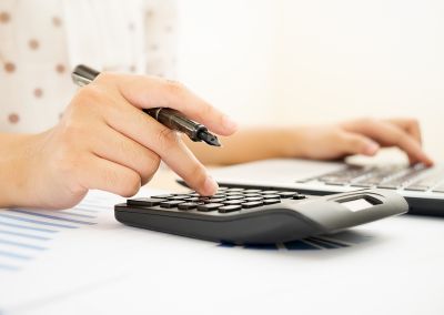 Image showing a person working on a calculator 